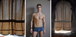 Ross Watson triptych photograph with portriat of underwear clad man in centre and hessian curtains either side.