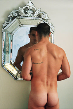 Ross Watson photograph of rear view of naked Paul Licuria standing in front of venetian mirror.