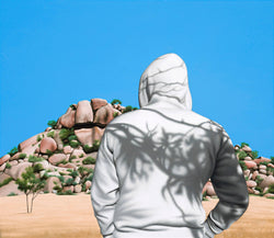 Painting of man in white hoody with shadows of trees on back standing in front of austalian desert rock formation
