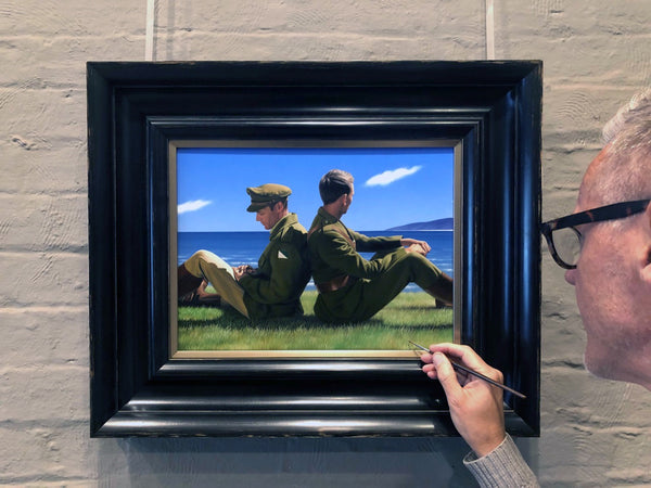 Ross Watson signing the painting entitled Two Light Horsemen on the lower right of the painting