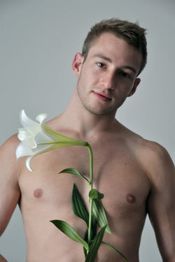 Ross Watson photographic portrait of Matthew Mitcham holding lily